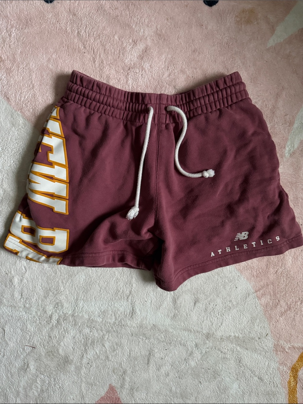 New Balance unisex Maroon Athletic Drawcord Shorts with Yellow Accent